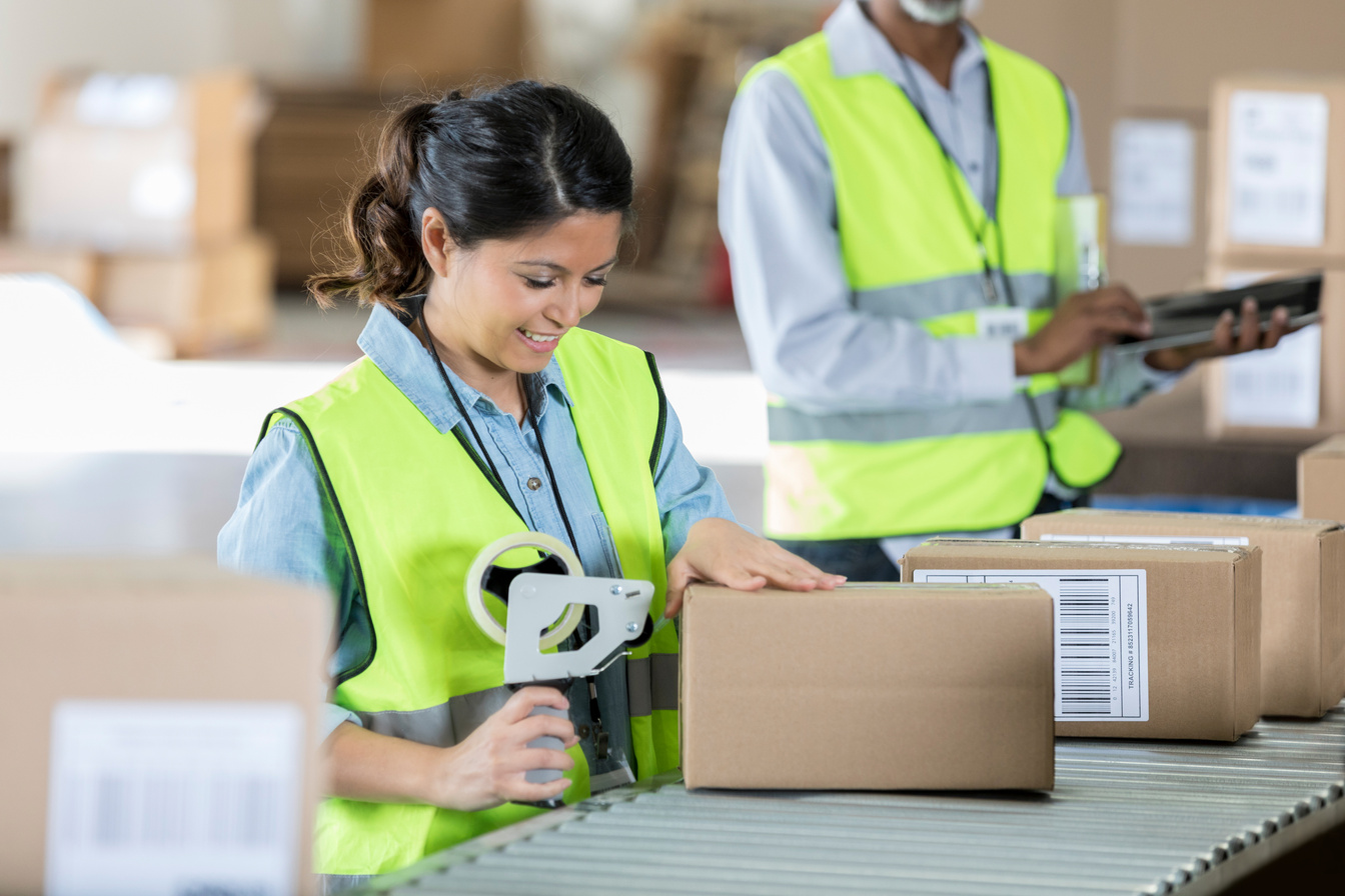 Warehouse worker seals package